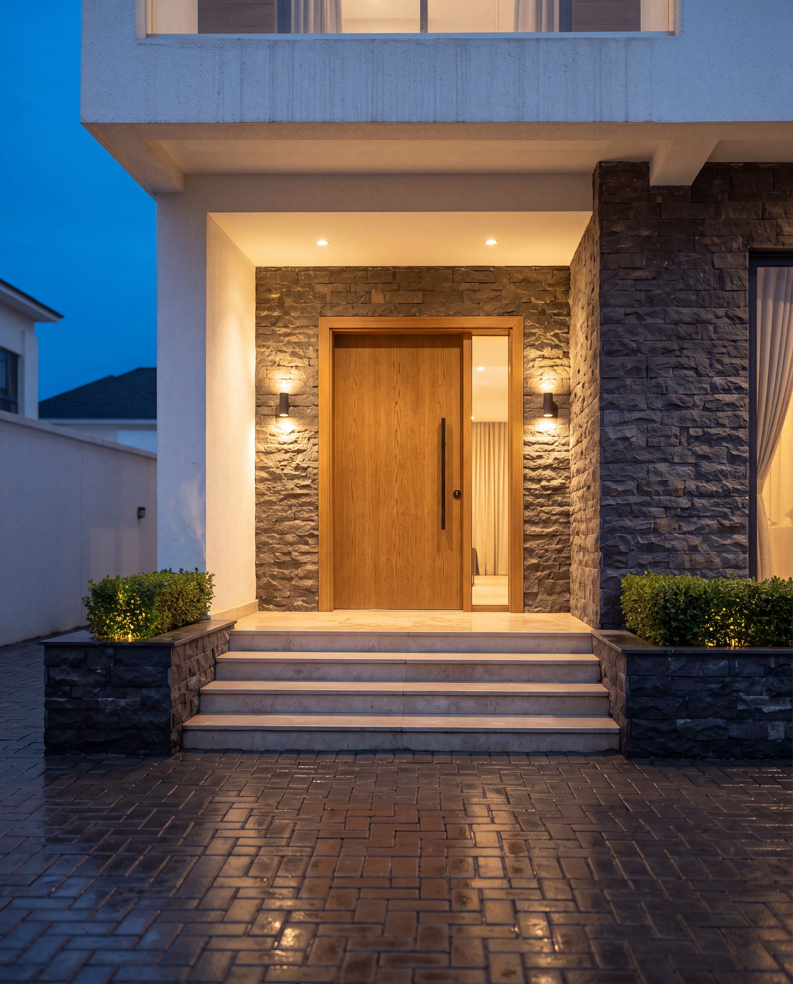 Design visualisation of a Claire Mont terrace front door in split-face stone at dusk